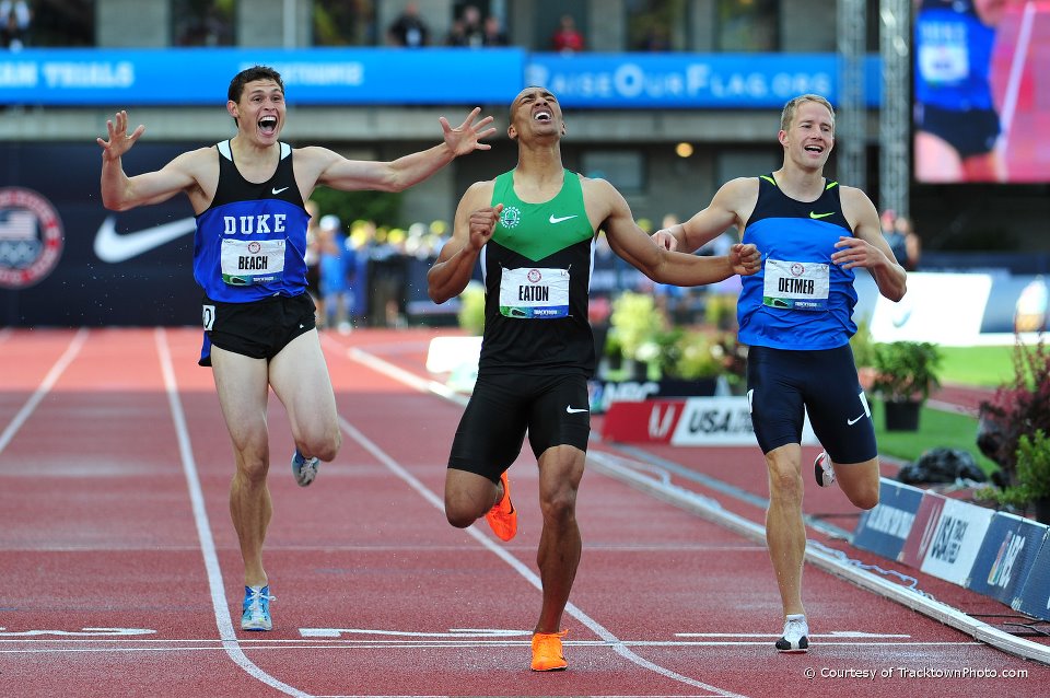 The world record holders in decathlon and in double decathlon at the finish line in Eugene